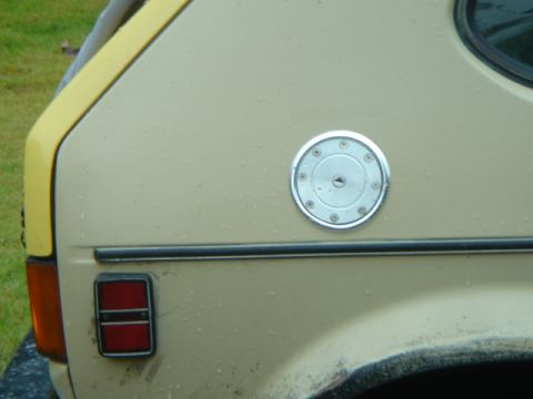 1983 Volkswagen Rabbit - Close-up of the gas cap on a tan 1983 Volkswagen Rabbit.