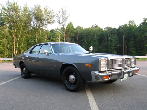 2001 Ford Crown Victoria - This sedan has a distinctive grille and chrome bumper, typical of late 1970s American sedans.