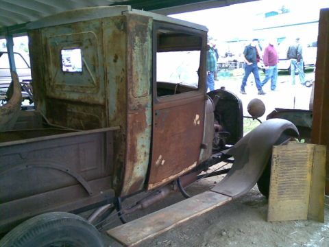 1969 Lincoln Continental - This heavily rusted pickup truck cab appears to be from an older model, with visible signs of wear and tear.