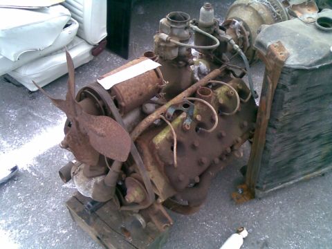 1969 Lincoln Continental - This heavily rusted V8 engine appears to be an older model, possibly from the mid-20th century.