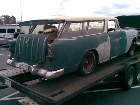 1969 Lincoln Continental - This station wagon, likely from the mid-1950s, is being transported on a trailer.