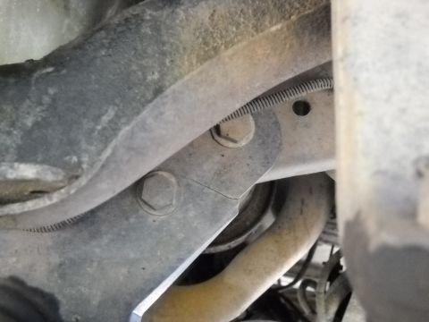 1996 Ford F-250 - Cracked suspension bracket on a vehicle, likely requiring repair or replacement.