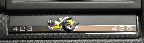 1973 Ford Ranchero - A close-up of a car's interior badge displays a bee graphic alongside numerical identifiers.