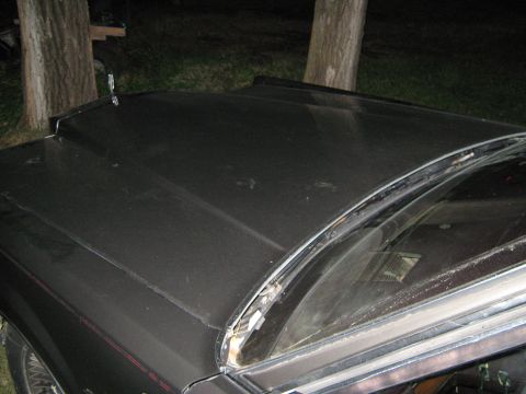 2000 Mercury Grand Marquis - The front of a car is shown, focusing on the hood and windshield area.