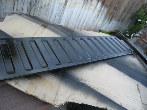 1986 Ford Bronco - Tailgate panel for a Ford Bronco, likely undergoing restoration or repair.