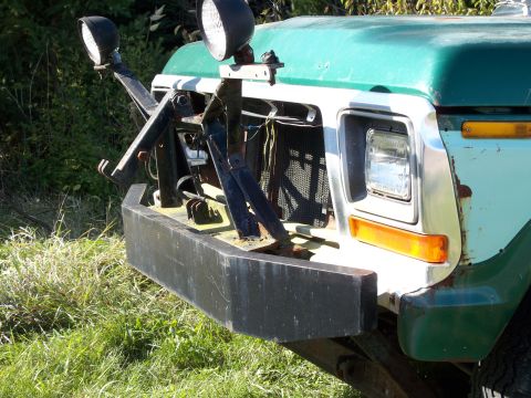 1988 Ford F-150 - Front end of a Ford F-Series truck, likely from the early 1980s, fitted with a plow mount.