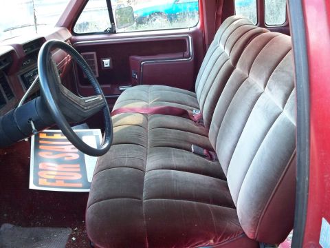 1988 Ford F-150 - The "XLT" badge on the dashboard suggests this is a Ford truck, likely from the 1980s.