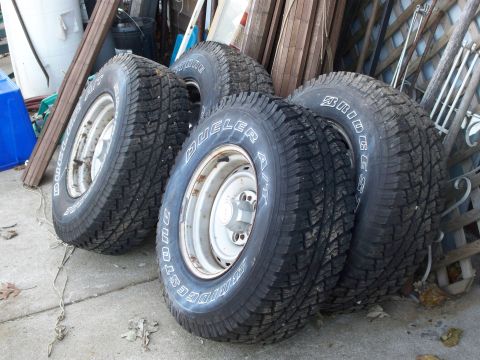 1988 Ford F-150 - A set of four Bridgestone Dueler A/T tires are shown resting on the ground.