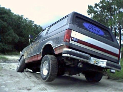 1991 Ford Bronco - 1991 Ford Bronco seen off-road with a Ford oval decal on the rear window.