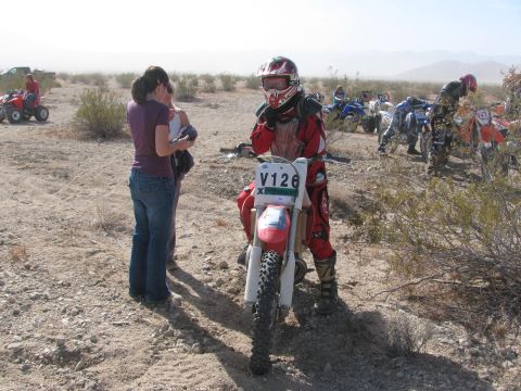 1996 Ford C-350 (Centurion Conversions) - A desert scene with multiple dirt bikes and ATVs, possibly at a race event.