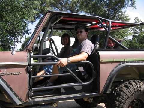 1967 Ford Mustang - A family poses inside a modified Ford Bronco, ready for an off-road adventure.