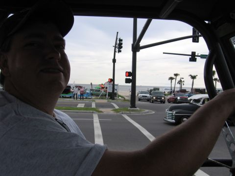 1967 Ford Mustang - View from inside a classic car at a street intersection, with a beach and ocean in the background.