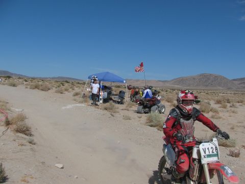1996 Ford C-350 (Centurion Conversions) - Desert race scene with dirt bike rider and ATVs.