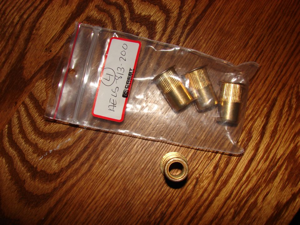 Bag of brass fittings with a label showing 'AE LS-813-200 (4) CREST'