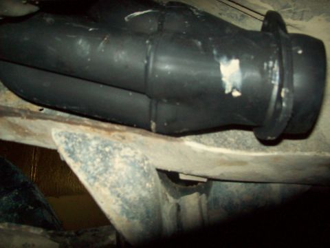 1985 Ford Bronco - Underside view of a vehicle's exhaust system, showing dual pipes and mounting hardware.