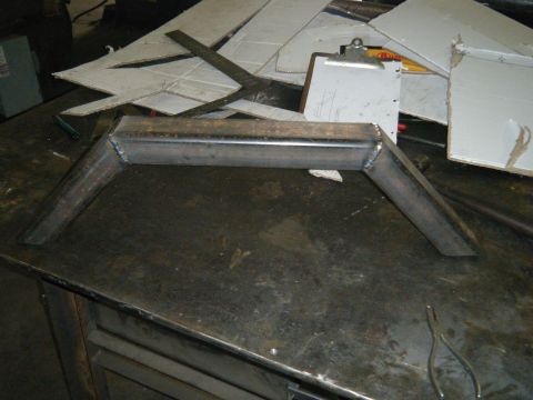 1978 Ford Bronco - A custom metal part is shown on a workbench, suggesting modifications or fabrication.