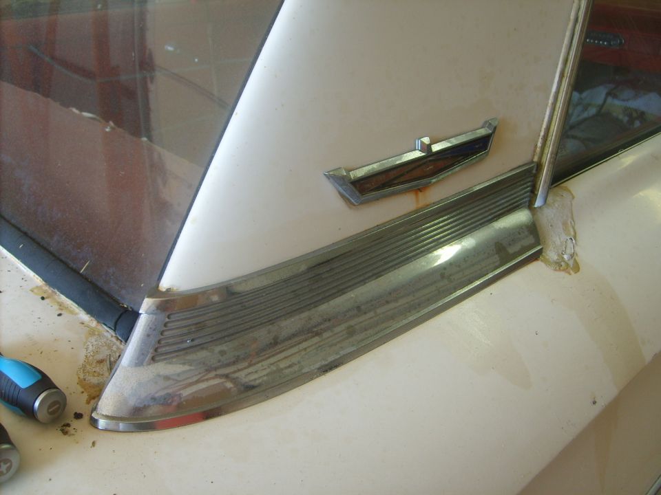 sail panel trim removal.  First I spray down in behind the panel with WD40 until it is running out from behind the trip.