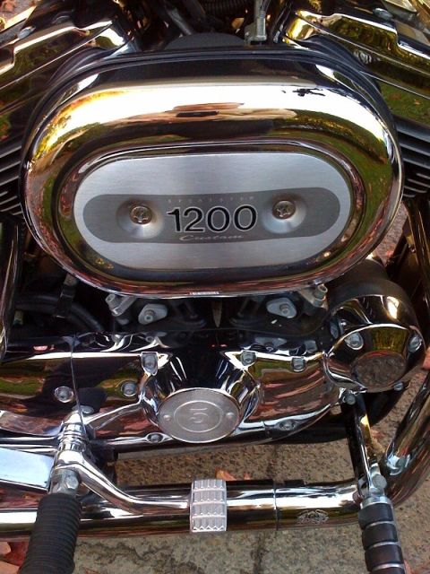 2001 Ford Crown Victoria - Close-up view of a motorcycle's engine components, including the air cleaner and chrome accents.