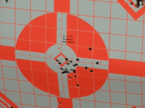 1996 Ford Bronco - This target shows bullet impacts and handwritten notes indicating a shooting session on 10-11-04 at 50 yards.
