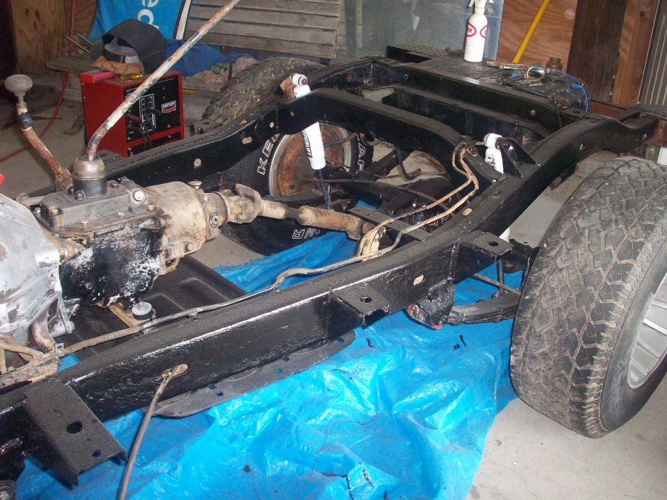 1978 Jeep CJ5 frame with transmission and suspension components, viewed from the side