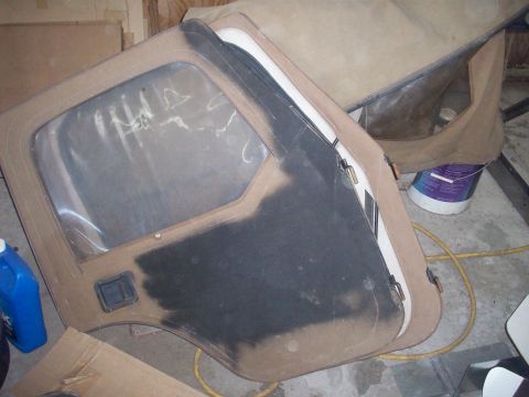1978 Jeep CJ5 - Two tan Jeep CJ doors with clear plastic windows are shown, one with a large black patch.