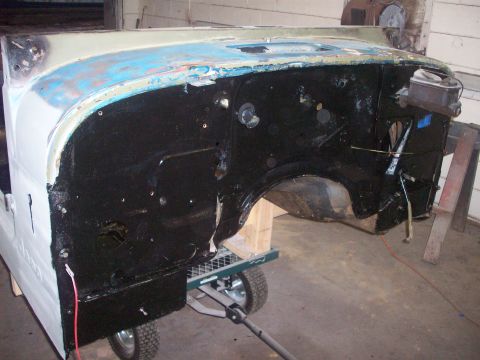 1978 Jeep CJ5 - Firewall and fender assembly of a Jeep CJ5, undergoing preparation for paint.