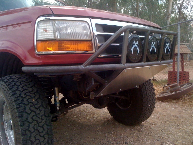 Red 1992 Ford Bronco front with custom bumper and lights