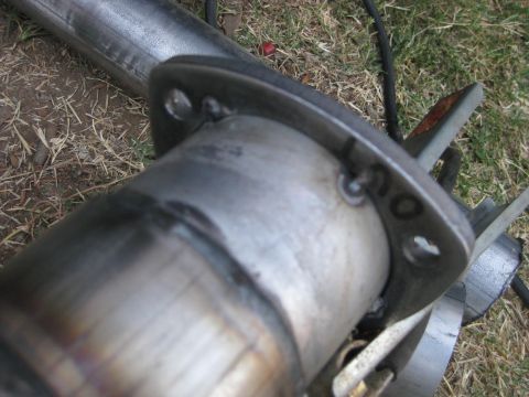 1995 Ford Bronco - A close-up view of a welded exhaust pipe flange, likely part of a custom exhaust system.