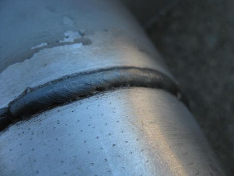 1995 Ford Bronco - Welded pipe section with visible weld bead and surface texture.