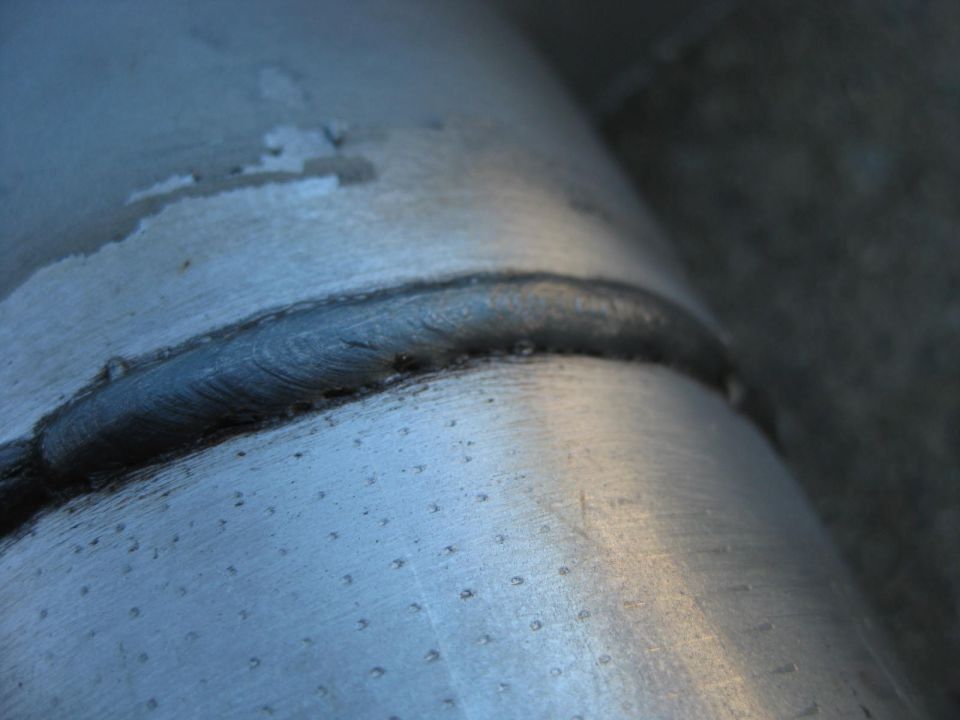 Close-up of a welded seam on a metal pipe