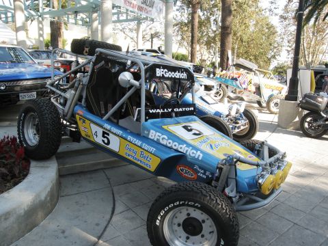 1986 Ford Bronco - This custom off-road buggy is displayed with other vehicles at an outdoor event.