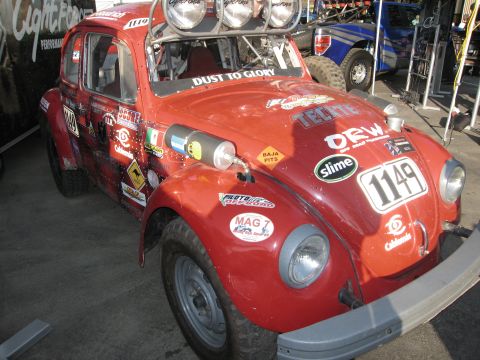 1986 Ford Bronco - This heavily stickered red Volkswagen Beetle is prepared for off-road racing, complete with auxiliary lights and spare fuel canisters.
