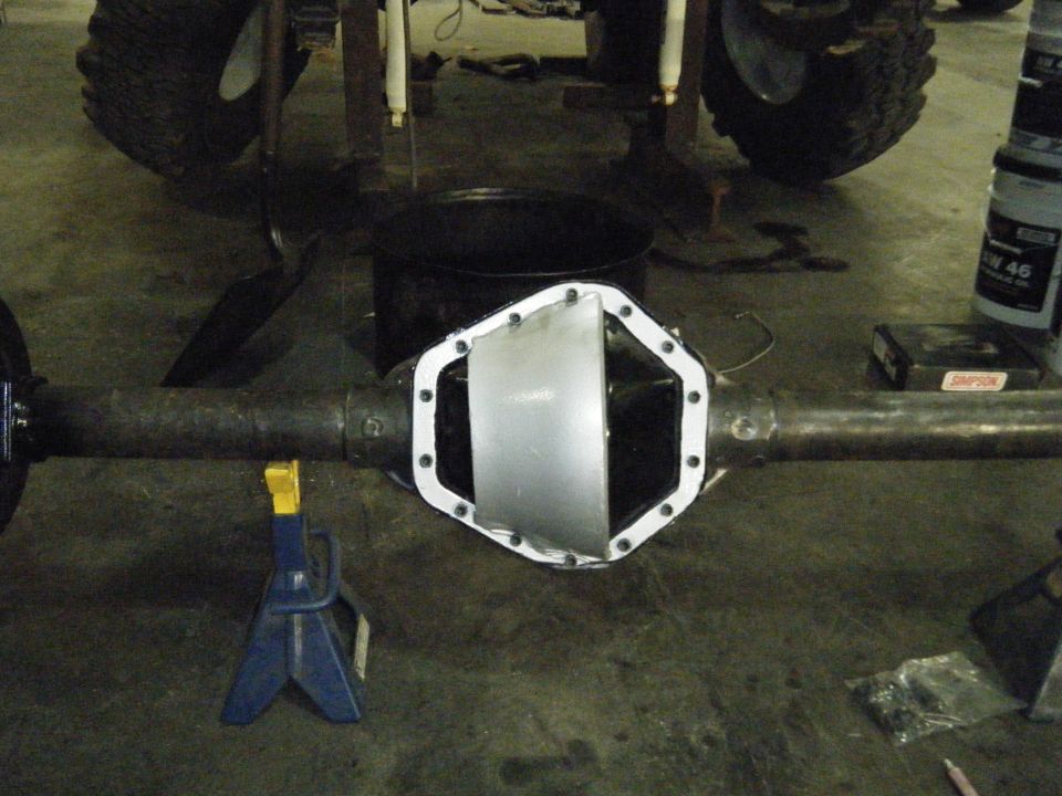 Rear differential with new cover installed. Vehicle on jack stands