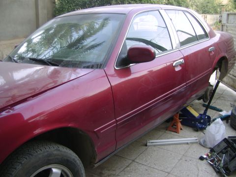 1998 Ford Crown Victoria - This 1998 Ford Crown Victoria is up on jack stands for rear shock installation.
