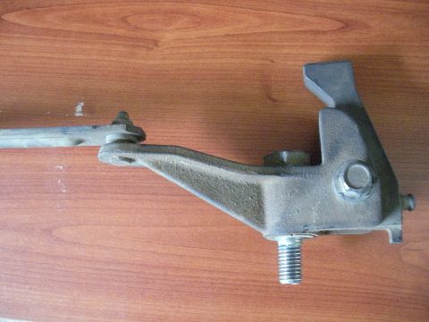 1990 Ford Bronco - A metal transfer case component is shown against a wooden background.