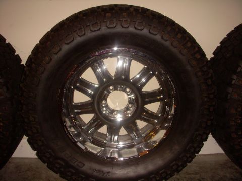 1993 Ford Bronco - Close-up of a chrome wheel and tire, likely for an off-road vehicle.