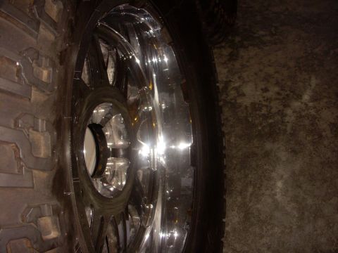 1993 Ford Bronco - Close-up of a chrome wheel and tire, likely for an off-road vehicle.