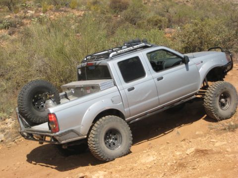 1996 Ford Bronco - This modified pickup truck is equipped for off-road adventures with its lifted suspension and tires.