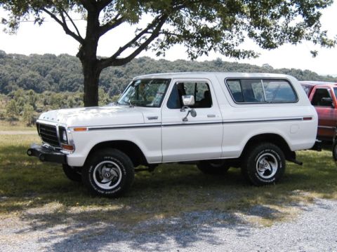 1994 Ford Bronco - Side view of a white Ford Bronco from the late 1970s.