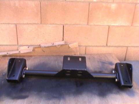 1997 Ford Ranger - This black metal automotive part is shown against a brick wall.
