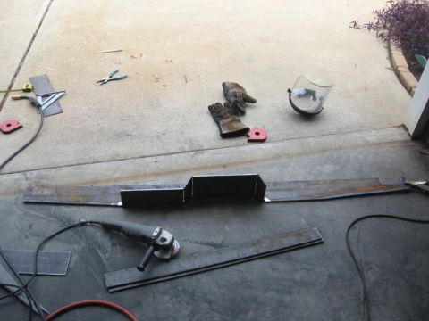 1995 Ford F-150 - Metal fabrication in progress, with tools and materials laid out on a concrete surface.