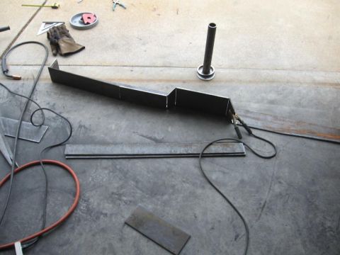 1995 Ford F-150 - Metal fabrication project in progress, showing a custom bumper part and welding supplies.