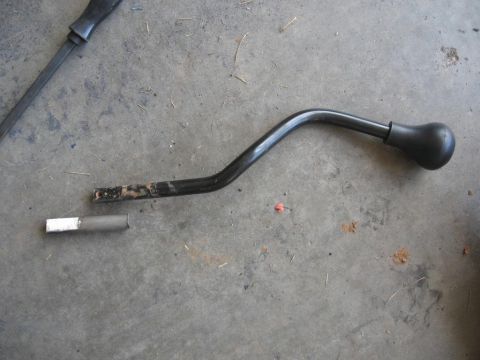 1995 Ford F-150 - Shifter lever broken at the base, with a separate piece of metal nearby on the floor.