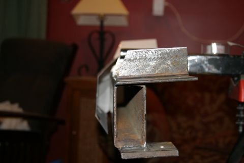 1987 Suzuki Samurai - Welded metal components are shown in a close-up view, suggesting a custom part fabrication.