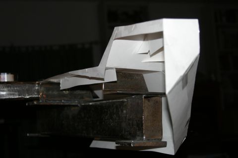 1987 Suzuki Samurai - A metal frame is partially covered by a white paper model, suggesting a prototype or design phase.