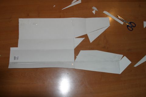 1987 Suzuki Samurai - A paper template, likely for a car bumper, is laid out on a wooden table with scissors nearby.