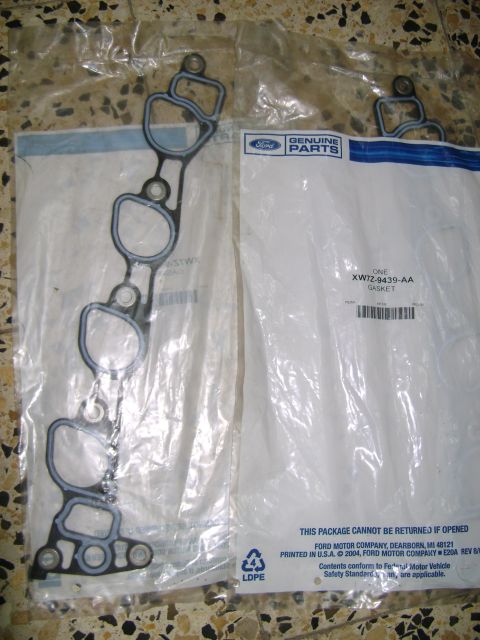 1998 Ford Crown Victoria - Ford OEM intake manifold gaskets in original packaging, one part number visible.