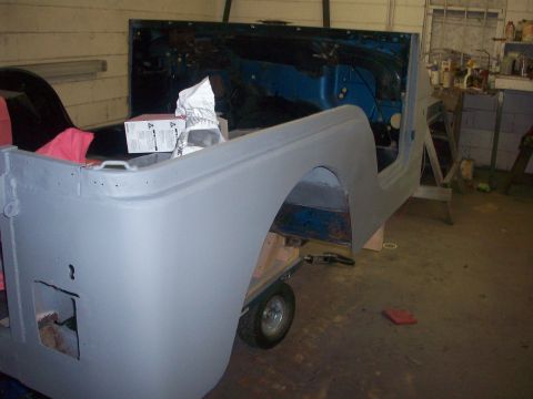 1978 Jeep CJ5 - Jeep CJ-5 body, primed and on a cart, appears to be undergoing restoration.