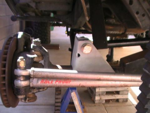 1997 Ford Ranger - Modified steering linkage with 'RACE PROOF' branding, likely for off-road use.