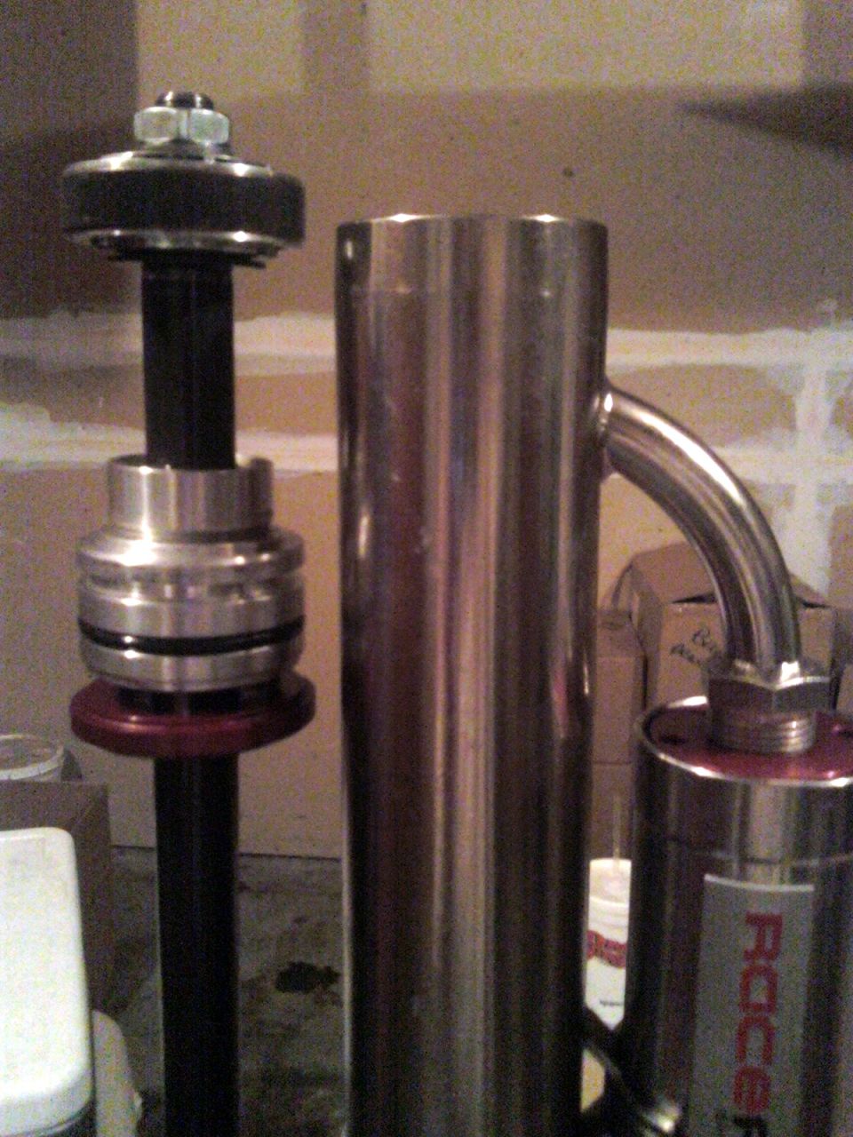 Shock absorber assembly with red base and exhaust pipe with ROC logo